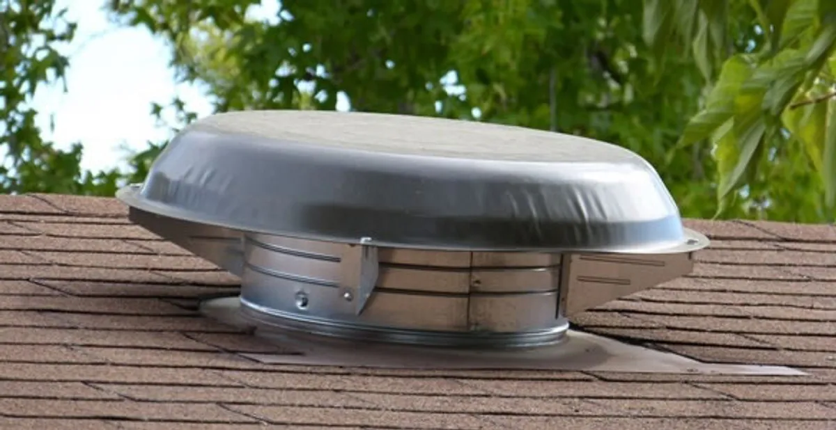 attic fan installation services with low-profile roof ventilation unit in Phoenix, AZ