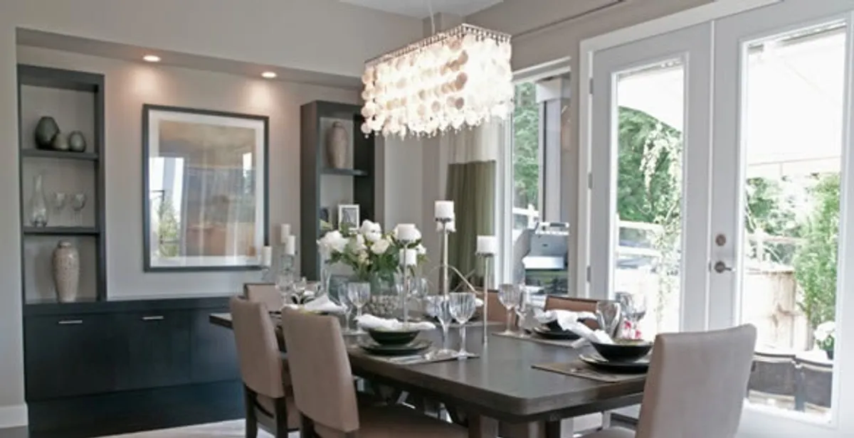 Elegant dining room chandelier installation above table in Phoenix, AZ