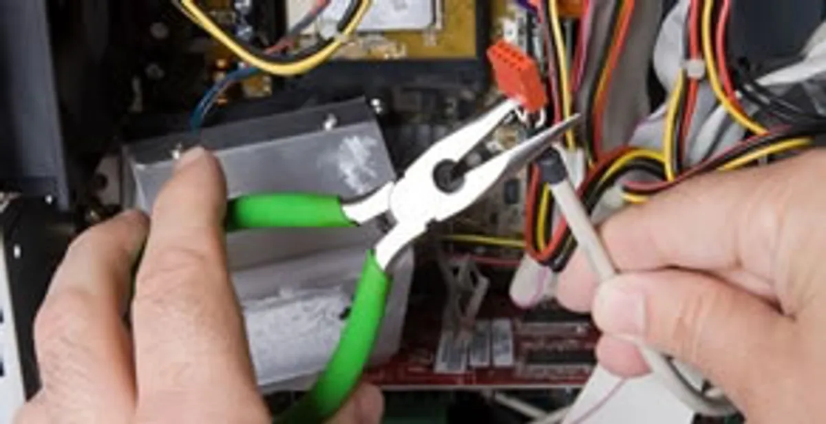 Licensed electrical contractor performing electrical repair with tools in Laveen, AZ